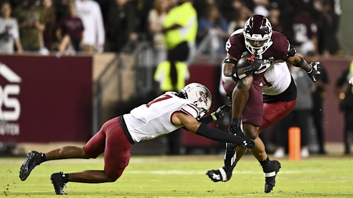 New Mexico State defensive end defensive end Justin Beadles makes a tackle in 2024