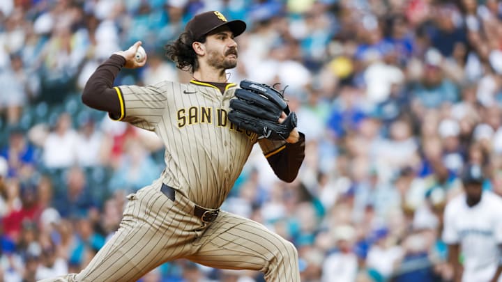 San Diego Padres pitcher Dylan Cease throws a baseball with his right hand in a brown pinstriped uniform and brown hat. San Diego Padres pitcher Dylan Cease throws a baseball with his right hand in a brown pinstriped uniform and brown hat.