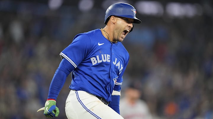 Toronto Blue Jays designated hitter George Springer (4) reacts as he runs the bases on his two run home run against the Boston Red Sox during the sixth inning at Rogers Centre. 