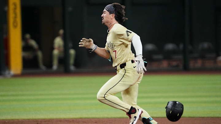 Aug 13, 2024; Phoenix, Arizona, USA; Arizona Diamondbacks outfielder Corbin Carroll (7) runs to third base en route to a triple against the Colorado Rockies during the ninth inning at Chase Field. Mandatory Credit: Joe Camporeale-Imagn Images