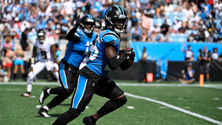 Sep 21, 2025; Charlotte, North Carolina, USA; Carolina Panthers cornerback Chau Smith-Wade (26) intercepts the ball and returns it for a touchdpwn as Atlanta Falcons quarterback Michael Penix Jr. (9) is in the background in the third quarter at Bank of America Stadium. Mandatory Credit: Bob Donnan-Imagn Images Sep 21, 2025; Charlotte, North Carolina, USA; Carolina Panthers cornerback Chau Smith-Wade (26) intercepts the ball and returns it for a touchdpwn as Atlanta Falcons quarterback Michael Penix Jr. (9) is in the background in the third quarter at Bank of America Stadium. Mandatory Credit: Bob Donnan-Imagn Images