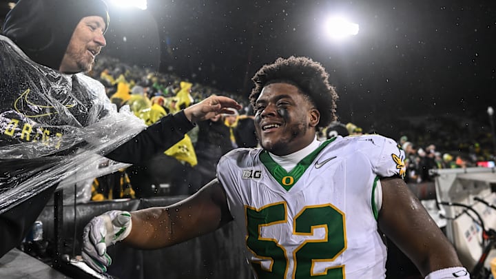 Nov 8, 2025; Iowa City, Iowa, USA; Oregon Ducks defensive lineman A'Mauri Washington (52) reacts with fans after the game against the Iowa Hawkeyes at Kinnick Stadium. Mandatory Credit: Jeffrey Becker-Imagn Images