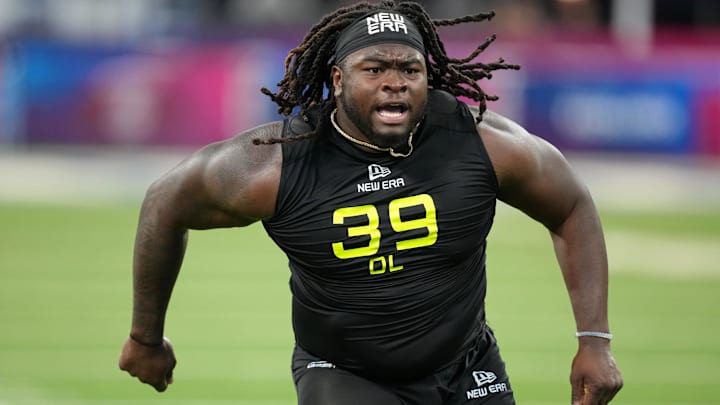 Indiana defensive tackle CJ West reacts after going through defensive line drills at the NFL Scouting Combine.