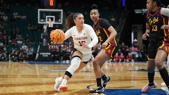 Mar 10, 2024; Las Vegas, NV, USA; Stanford Cardinal guard Talana Lepolo (10) dribbles the ball against Southern California Trojans guard JuJu Watkins (12) and center Rayah Marshall (13) in the first half of the Pac-12 Tournament women's championship game at MGM Grand Garden Arena. Mandatory Credit: Kirby Lee-Imagn Images Mar 10, 2024; Las Vegas, NV, USA; Stanford Cardinal guard Talana Lepolo (10) dribbles the ball against Southern California Trojans guard JuJu Watkins (12) and center Rayah Marshall (13) in the first half of the Pac-12 Tournament women's championship game at MGM Grand Garden Arena. Mandatory Credit: Kirby Lee-Imagn Images