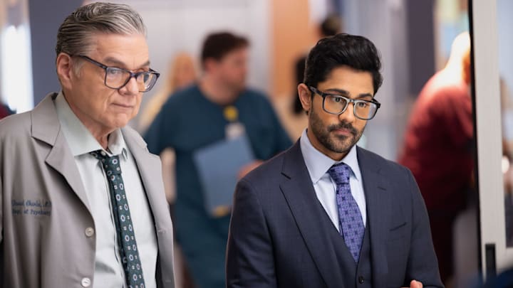 CHICAGO MED -- "The Cost of Living" Episode 1114 -- Pictured: (l-r) Oliver Platt as Dr. Daniel Charles, Manish Dayal as Dr. Theo Rabari CHICAGO MED -- "The Cost of Living" Episode 1114 -- Pictured: (l-r) Oliver Platt as Dr. Daniel Charles, Manish Dayal as Dr. Theo Rabari