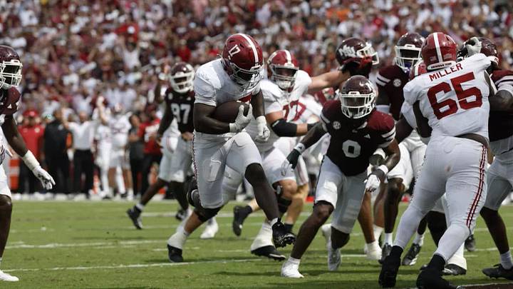 Tyrell Miller (65) blocking for a Trae'shawn Brown (17) touchdown at Mississippi State