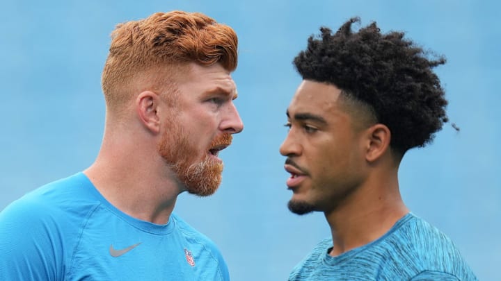 CHARLOTTE, NORTH CAROLINA - SEPTEMBER 29: Andy Dalton #14 and Bryce Young #9 of the Carolina Panthers look on before the game against the Cincinnati Bengals at Bank of America Stadium on September 29, 2024 in Charlotte, North Carolina.