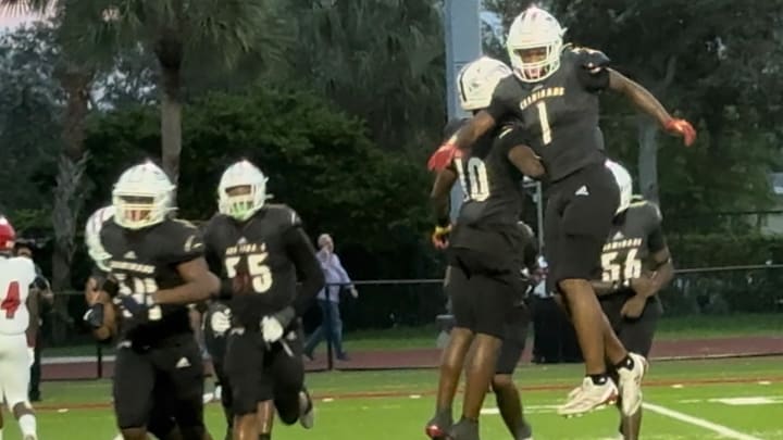 Chaminade-Madonna sensation Derrek Cooper (1) is flying high after his strip sack and fumble recovery in the Lions win over Miami Edison.