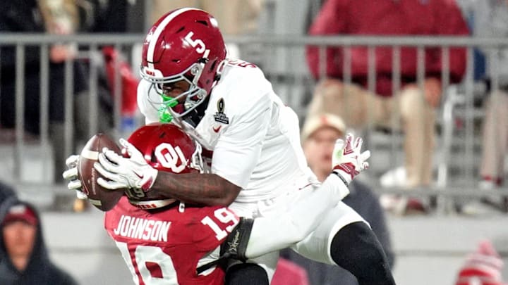 Alabama 's Germie Bernard (5) makes a catch over Oklahoma's Gentry Williams (9) during the College Football Playoff game between the University of Oklahoma Sooners (OU) and the Alabama Crimson Tide at the Gaylord Family – Oklahoma Memorial Stadium in Norman, Okla., Friday Dec. 19, 2025. Alabama 's Germie Bernard (5) makes a catch over Oklahoma's Gentry Williams (9) during the College Football Playoff game between the University of Oklahoma Sooners (OU) and the Alabama Crimson Tide at the Gaylord Family – Oklahoma Memorial Stadium in Norman, Okla., Friday Dec. 19, 2025.