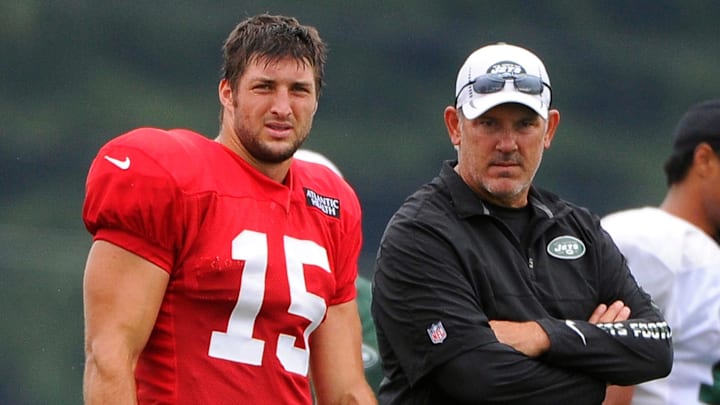 Aug 15, 2012; Cortland, NY, USA; New York Jets quarterback Tim Tebow (15) and quarterbacks coach Matt Cavanaugh look on during training camp at SUNY Cortland. Mandatory Credit: Rich Barnes-Imagn Images Aug 15, 2012; Cortland, NY, USA; New York Jets quarterback Tim Tebow (15) and quarterbacks coach Matt Cavanaugh look on during training camp at SUNY Cortland. Mandatory Credit: Rich Barnes-Imagn Images