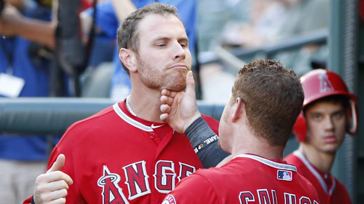 Angels left fielder Josh Hamilton (32) and right fielder Kole Calhoun (56) joke around before the game against the Texas Rangers at Globe Life Park in Arlington on July 10, 2014.