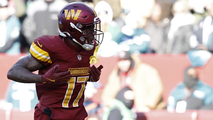 Dec 22, 2024; Landover, Maryland, USA; Washington Commanders wide receiver Terry McLaurin (17) celebrates after catching a touchdown pass against the Philadelphia Eagles during the second quarter at Northwest Stadium. Mandatory Credit: Geoff Burke-Imagn Images