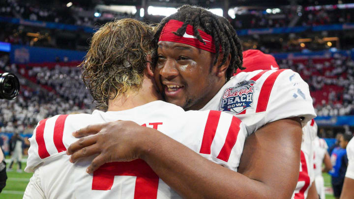 Dec 30, 2023; Atlanta, GA, USA; Mississippi Rebels quarterback Jaxson Dart (2) celebrates with defensive end Jared Ivey (15) after a victory against the Penn State Nittany Lions in the Peach Bowl at Mercedes-Benz Stadium. Mandatory Credit: Brett Davis-USA TODAY Sports
