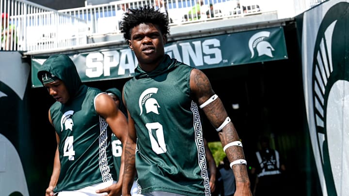 Michigan State's Ed Woods, left, and Charles Brantley take the field to warm up before the football game against Prairie View A&M on Saturday, Sept. 14, 2024, at Spartan Stadium in East Lansing.