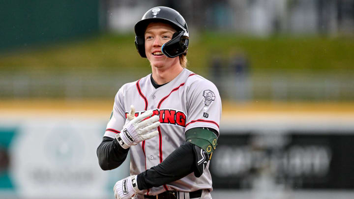 Lugnuts' Henry Bolte smiles after an out in the second inning on Wednesday, April 3, 2024, during the Crosstown Showdown against Michigan State at Jackson Field in Lansing.