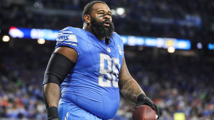Detroit Lions defensive end Isaiah Buggs (96) walks off the field after recovering the fumble from Denver Broncos quarterback Russell Wilson (3) during the first half at Ford Field in Detroit on Saturday, Dec. 16, 2023.