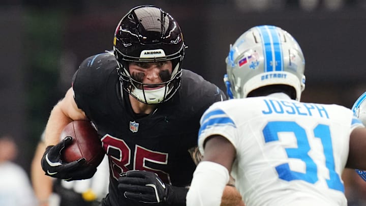 Arizona Cardinals tight end Trey McBride (85) runs with the ball as Detroit Lions safety Kerby Joseph (31) closes in at State Farm Stadium in Glendale, Ariz., Sep 22, 2024. Arizona Cardinals tight end Trey McBride (85) runs with the ball as Detroit Lions safety Kerby Joseph (31) closes in at State Farm Stadium in Glendale, Ariz., Sep 22, 2024.