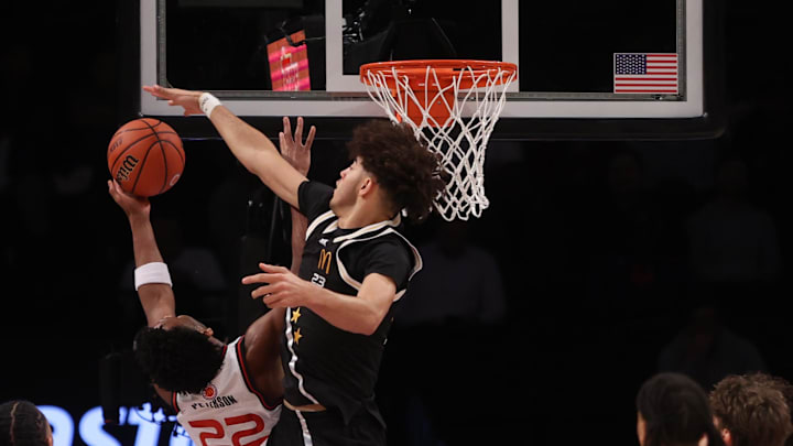 Apr 1, 2025; Brooklyn, NY, USA; McDonald's All American East center Malachi Moreno (23) blocks a shot by McDonald's All American West guard Darryn Peterson (22) during the second half of the game at Barclays Center. Mandatory Credit: Pamela Smith-Imagn Images