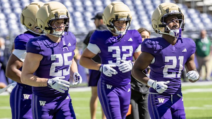 Quaid Carr (21) is a redshirt freshman running back, shown with walk-ons Beck Walker (25) and Ryken Moon (32).