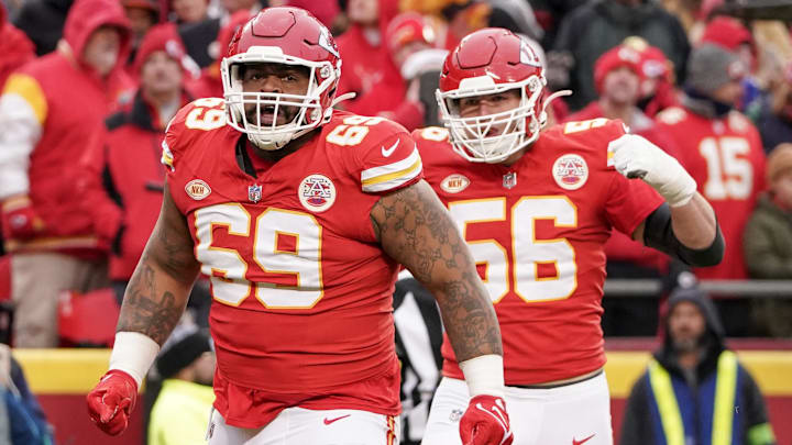 Dec 25, 2023; Kansas City, Missouri, USA; Kansas City Chiefs defensive tackle Mike Pennel Jr. (69) celebrates with defensive end George Karlaftis (56) after a play against the Las Vegas Raiders during the game at GEHA Field at Arrowhead Stadium. Mandatory Credit: Denny Medley-Imagn Images