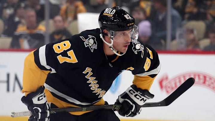 Dec 10, 2024; Pittsburgh, Pennsylvania, USA;  Pittsburgh Penguins center Sidney Crosby (87) prepare to take a face-off against the Colorado Avalanche during the first period at PPG Paints Arena. Mandatory Credit: Charles LeClaire-Imagn Images
