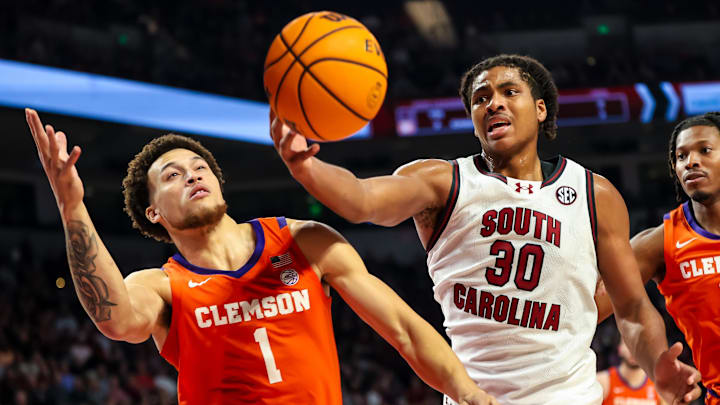 Dec 17, 2024; Columbia, South Carolina, USA; South Carolina Gamecocks forward Collin Murray-Boyles (30) grabs a rebound in front of Clemson Tigers guard Chase Hunter (1) in the first half at Colonial Life Arena. Mandatory Credit: Jeff Blake-Imagn Images