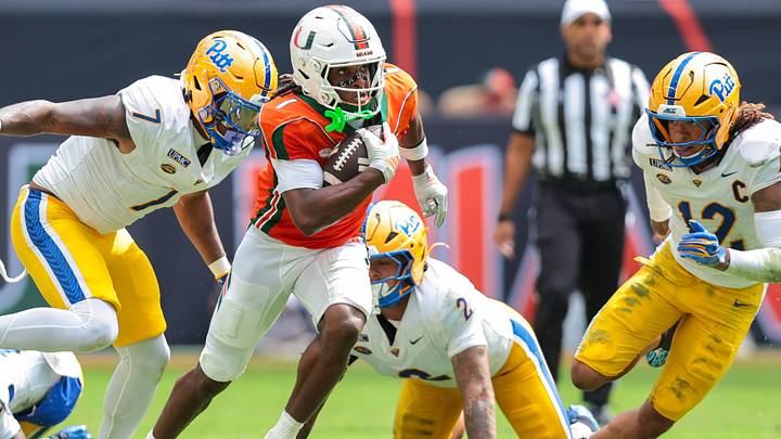 Oct 24, 2026; Miami Gardens, Florida, USA; Miami Hurricanes wide receiver Malachi Toney (1) runs with the football against Pittsburgh Panthers linebacker DeMarco Ward (7) and defensive back Cruce Brookins (12) during the second quarter at Hard Rock Stadium. Mandatory Credit: Sam Navarro-Imagn Images Oct 24, 2026; Miami Gardens, Florida, USA; Miami Hurricanes wide receiver Malachi Toney (1) runs with the football against Pittsburgh Panthers linebacker DeMarco Ward (7) and defensive back Cruce Brookins (12) during the second quarter at Hard Rock Stadium. Mandatory Credit: Sam Navarro-Imagn Images