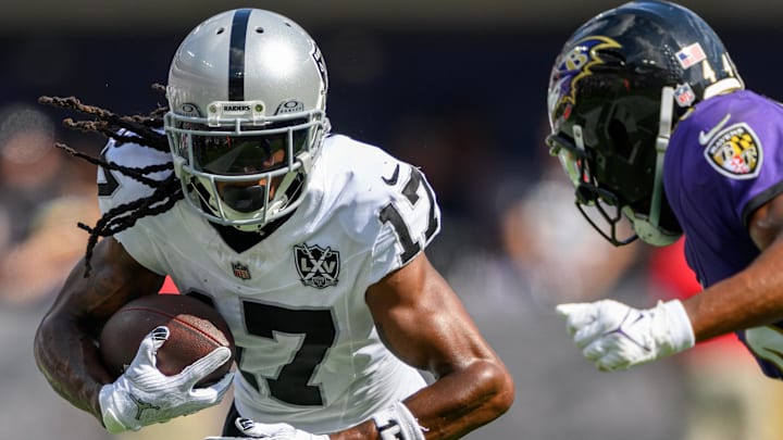 Sep 15, 2024; Baltimore, Maryland, USA; Las Vegas Raiders wide receiver Davante Adams (17) runs with the ball as Baltimore Ravens cornerback Marlon Humphrey (44) defends during the second half at M&T Bank Stadium. Mandatory Credit: Reggie Hildred-Imagn Images