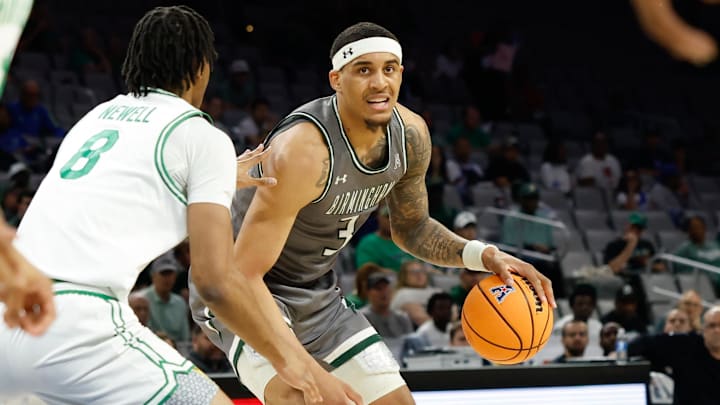 Mar 15, 2025; Fort Worth, TX, USA;  UAB Blazers forward Yaxel Lendeborg (3) controls the ball as North Texas Mean Green forward Grant Newell (8) defends during the first half at Dickies Arena. Mandatory Credit: Chris Jones-Imagn Images