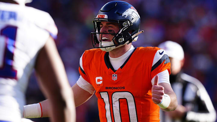 Jan 17, 2026; Denver, CO, USA; Denver Broncos quarterback Bo Nix (10) calls an audible during the first quarter of an AFC Divisional Round playoff game against the Buffalo Bills at Empower Field at Mile High. 