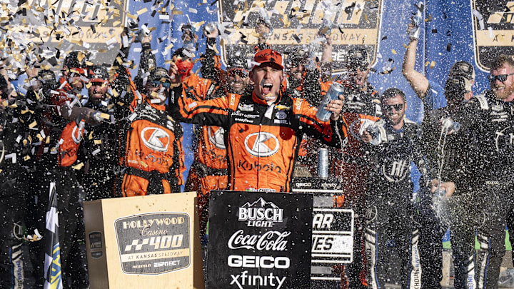 Sep 29, 2024; Kansas City, Kansas, USA; NASCAR Cup Series driver Ross Chastain (1) celebrates in Victory Lane with his team following his win at the Hollywood Casino 400 at Kansas Speedway. Sep 29, 2024; Kansas City, Kansas, USA; NASCAR Cup Series driver Ross Chastain (1) celebrates in Victory Lane with his team following his win at the Hollywood Casino 400 at Kansas Speedway.