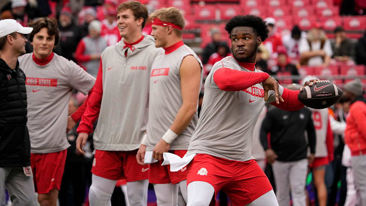 Ohio State Buckeyes quarterback Air Noland (12) warms up prior to the NCAA football game against the Indiana Hoosiers at Ohio Stadium in Columbus on Saturday, Nov. 23, 2024.