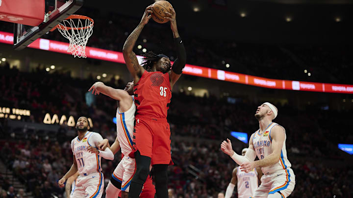 Jan 26, 2025; Portland, Oregon, USA; Portland Trail Blazers center Robert Williams III (35) grabs a rebound during the first half against Oklahoma City Thunder forward Jaylin Williams (6) at Moda Center. Mandatory Credit: Troy Wayrynen-Imagn Images Jan 26, 2025; Portland, Oregon, USA; Portland Trail Blazers center Robert Williams III (35) grabs a rebound during the first half against Oklahoma City Thunder forward Jaylin Williams (6) at Moda Center. Mandatory Credit: Troy Wayrynen-Imagn Images
