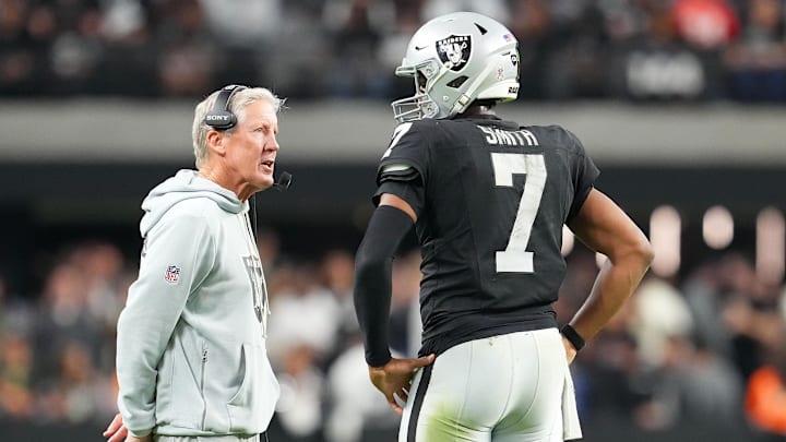 Nov 23, 2025; Paradise, Nevada, USA; Las Vegas Raiders quarterback Geno Smith (7) talks to head coach Pete Carroll in game against the Cleveland Browns during the fourth quarter at Allegiant Stadium. Mandatory Credit: Stephen R. Sylvanie-Imagn Images Nov 23, 2025; Paradise, Nevada, USA; Las Vegas Raiders quarterback Geno Smith (7) talks to head coach Pete Carroll in game against the Cleveland Browns during the fourth quarter at Allegiant Stadium. Mandatory Credit: Stephen R. Sylvanie-Imagn Images