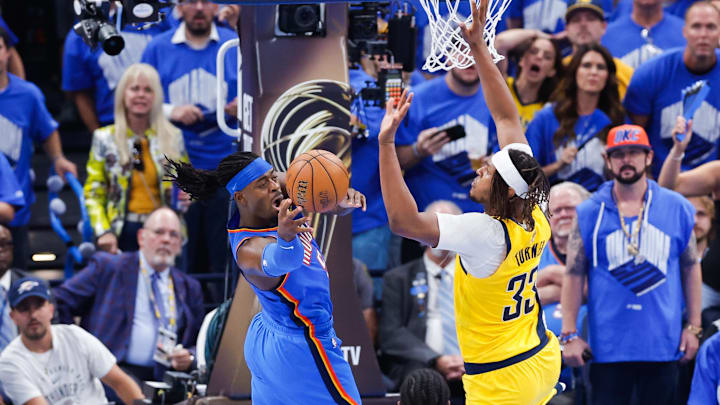 Jun 22, 2025; Oklahoma City, Oklahoma, USA; Oklahoma City Thunder guard Luguentz Dort (5) drives to the basket while Indiana Pacers center Myles Turner (33) defends during the second half of game seven of the 2025 NBA Finals at Paycom Center. Mandatory Credit: Alonzo Adams-Imagn Images