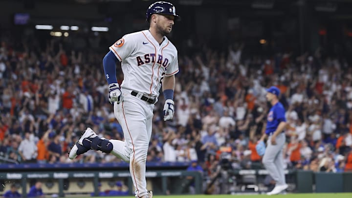 May 17, 2023; Houston, Texas, USA; Chicago Cubs starting pitcher Drew Smyly (11) reacts and Houston Astros third baseman Alex Bregman (2) runs to first base on a home run during the first inning at Minute Maid Park.