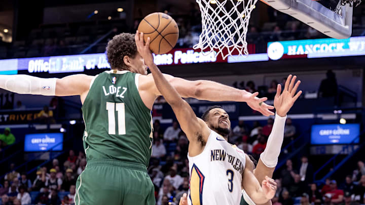 Mar 28, 2024; New Orleans, Louisiana, USA; New Orleans Pelicans guard CJ McCollum (3) drives to the basket against Milwaukee Bucks center Brook Lopez (11) during the second half at Smoothie King Center. Mar 28, 2024; New Orleans, Louisiana, USA; New Orleans Pelicans guard CJ McCollum (3) drives to the basket against Milwaukee Bucks center Brook Lopez (11) during the second half at Smoothie King Center.