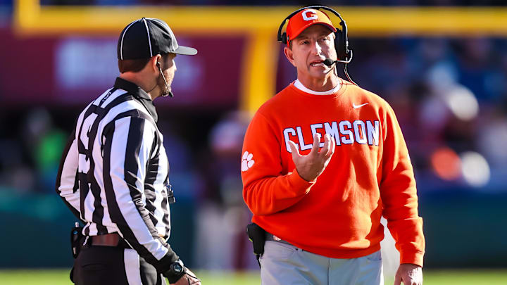 Nov 29, 2025; Columbia, South Carolina, USA; Clemson Tigers head coach Dabo Swinney makes his case during a review of a an interception against the South Carolina Gamecocks in the third quarter at Williams-Brice Stadium. Mandatory Credit: Jeff Blake-Imagn Images