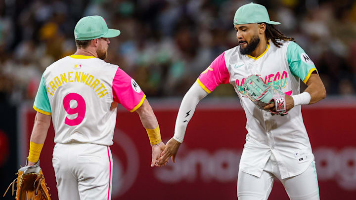 Aug 22, 2025; San Diego, California, USA; San Diego Padres second baseman Jake Cronenworth (9) celebrates with right fielder Fernando Tatis Jr. (23) after defeating the the Los Angeles Dodgers at Petco Park. Mandatory Credit: David Frerker-Imagn Images Aug 22, 2025; San Diego, California, USA; San Diego Padres second baseman Jake Cronenworth (9) celebrates with right fielder Fernando Tatis Jr. (23) after defeating the the Los Angeles Dodgers at Petco Park. Mandatory Credit: David Frerker-Imagn Images