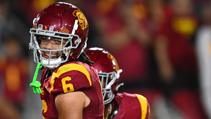 Sep 7, 2024; Los Angeles, California, USA; USC Trojans wide receiver Makai Lemon (6) celebrates after scoring a touchdown against the Utah State Aggies during the second quarter at United Airlines Field at Los Angeles Memorial Coliseum. Mandatory Credit: Jonathan Hui-Imagn Images