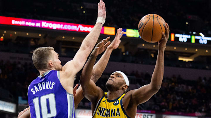 Feb 3, 2023; Indianapolis, Indiana, USA;  Indiana Pacers center Myles Turner (33) shoots the ball while Sacramento Kings forward Domantas Sabonis (10)  defends in the first quarter at Gainbridge Fieldhouse. Mandatory Credit: Trevor Ruszkowski-Imagn Images