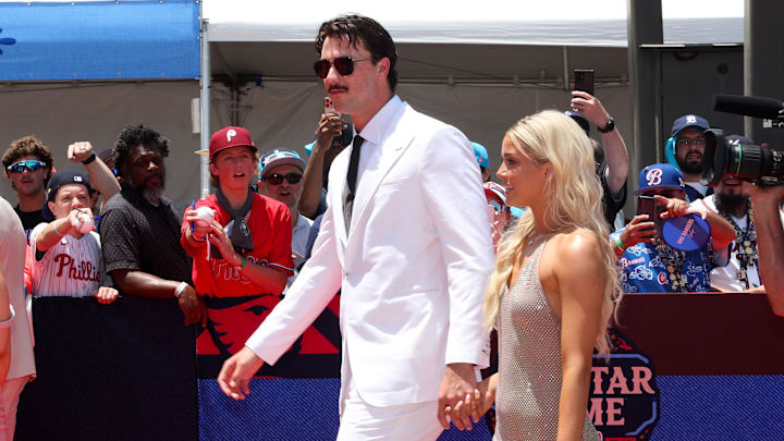 Jul 16, 2024; Arlington, Texas, USA; Pittsburgh Pirates pitcher Paul Skenes walks the red carpet with LSU gymnast and girlfriend Livvy Dunne before the 2024 MLB All-Star game at Globe Life Field. Mandatory Credit: Kevin Jairaj-Imagn Images