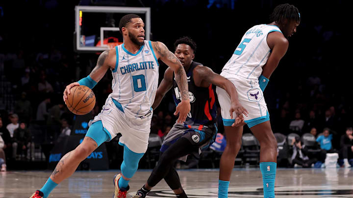 Nov 30, 2023; Brooklyn, New York, USA; Charlotte Hornets forward Miles Bridges (0) drives around Brooklyn Nets forward Dorian Finney-Smith (28) as Hornets center Mark Williams (5) sets a pick during the third quarter at Barclays Center. Mandatory Credit: Brad Penner-Imagn Images Nov 30, 2023; Brooklyn, New York, USA; Charlotte Hornets forward Miles Bridges (0) drives around Brooklyn Nets forward Dorian Finney-Smith (28) as Hornets center Mark Williams (5) sets a pick during the third quarter at Barclays Center. Mandatory Credit: Brad Penner-Imagn Images