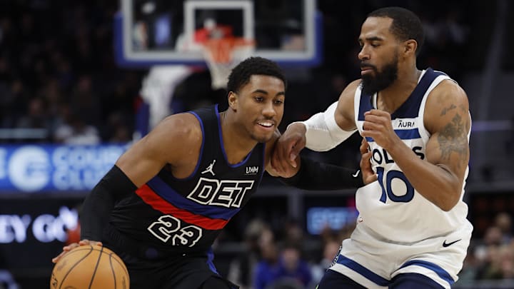 Jan 17, 2024; Detroit, Michigan, USA; Detroit Pistons guard Jaden Ivey (23) dribbles defended by Minnesota Timberwolves guard Mike Conley (10): Rick Osentoski-Imagn Images