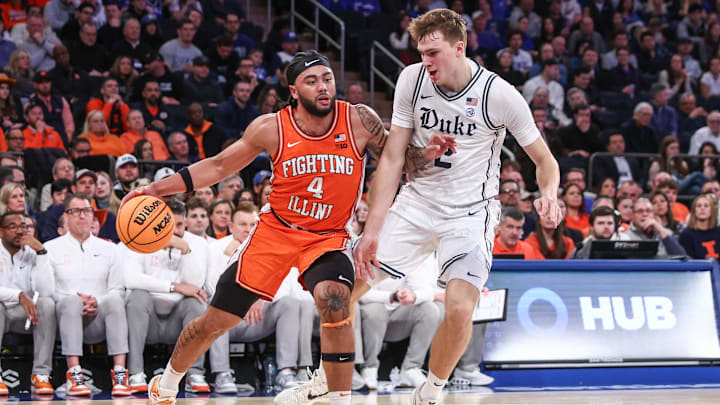 Feb 22, 2025; New York, NY, USA;  Illinois Fighting Illini guard Kylan Boswell (4) drives past Duke Blue Devils guard Cooper Flagg (2) in the second half at Madison Square Garden. Mandatory Credit: Wendell Cruz-Imagn Images