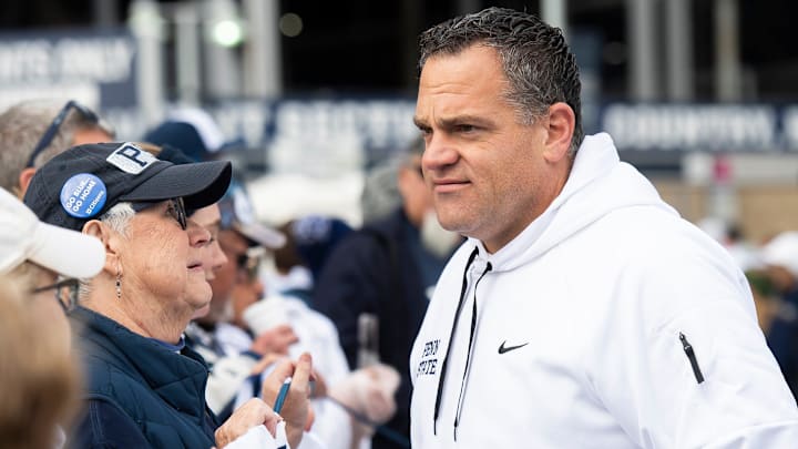 Penn State athletic director Pat Kraft talks with members of an alumni group outside of Beaver Stadium before an NCAA football game against Michigan Saturday, Nov. 11, 2023, in State College, Pa.