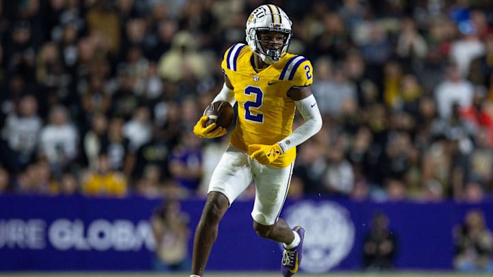 Nov 23, 2024; Baton Rouge, Louisiana, USA;  LSU Tigers wide receiver Kyren Lacy (2) runs after a catch against the Vanderbilt Commodores during the first half at Tiger Stadium. Mandatory Credit: Stephen Lew-Imagn Images