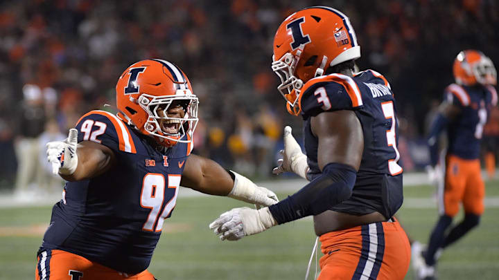 Sep 13, 2025; Champaign, Illinois, USA;  Illinois Fighting Illini defensive lineman Gentle Hunt (92) and teammate Alec Bryant (3) celebrate a sack during the second half against the Western Michigan Broncos at Memorial Stadium. Mandatory Credit: Ron Johnson-Imagn Images
