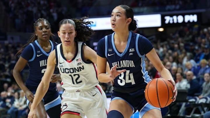 Jan 22, 2025; Storrs, Connecticut, USA; Villanova Wildcats guard Maddie Webber (34) drives the ball against UConn Huskies guard Ashlynn Shade (12) in the first half at Harry A. Gampel Pavilion. Mandatory Credit: David Butler II-Imagn Images