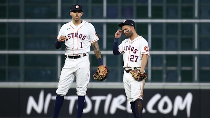 Nov 2, 2021; Houston, TX, USA; Houston Astros infielders Carlos Correa (1) and Jose Altuve (27) react during the eighth inning against the Atlanta Braves in game six of the 2021 World Series at Minute Maid Park. Nov 2, 2021; Houston, TX, USA; Houston Astros infielders Carlos Correa (1) and Jose Altuve (27) react during the eighth inning against the Atlanta Braves in game six of the 2021 World Series at Minute Maid Park.